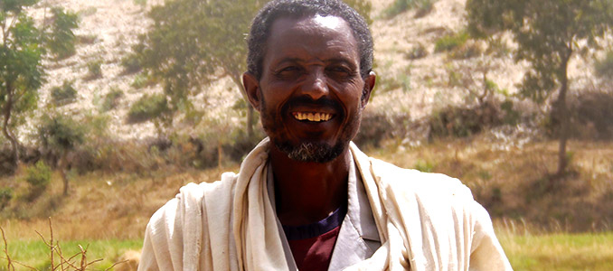 Irish Aid feature, man in front of hill