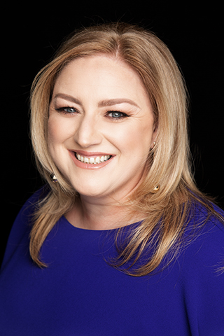 Dearbhail McDonald - professional headshot of a blonde woman wearing a blue blouse.